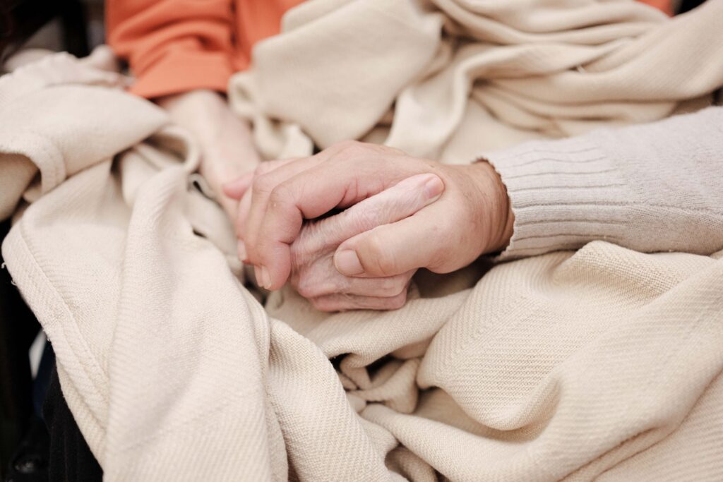 short-term rehab two women holding hands at a skilled nursing facility
