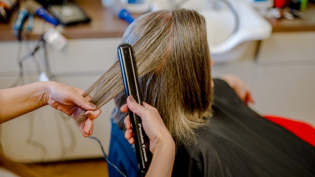 A woman getting her hair done at Kathrine's Place a skilled nursing facility